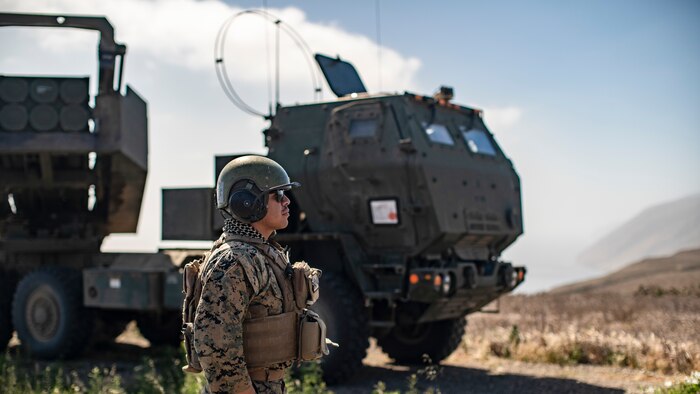 U.S. Marine Corps Sgt. Elias Munoz, a launcher chief with Bravo Battery, Battalion Landing Team 1/1, 11th Marine Expeditionary Unit, prepares a High Mobility Artillery Rocket System for a simulated long-range strike mission at San Clemente Island, Calif., May 20, 2021. The Battery went ashore in support of an expeditionary advanced basing exercise, targeting simulated enemy on the island, and enemy vessels nearby. The Marines and Sailors of the 11th MEU and Essex Amphibious Ready Group are conducting routine training off the coast of southern California.