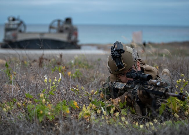 U.S. Marine Corps Pfc. Jacob Gastelum, a rifleman with Alpha Company, Battalion Landing Team 1/1, 11th Marine Expeditionary Unit, holds security for an amphibious landing as part of an expeditionary advance base exercise, May 15. Marines and Sailors of the 11th MEU and Essex Amphibious Ready Group are conducting integrated training on and off the coast of southern California.