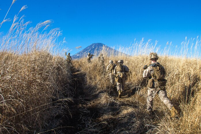 U.S. Marines with Kilo Company, 3rd Battalion, 8th Marine Regiment, patrol at Combined Arms Training Center, Camp Fuji, Japan, Jan. 21, 2021. Marines patrolled in disaggregated units towards a common objective for Joint Exercise Littoral Strike, the culminating event for Fuji Viper 21.2, that strengthened interoperability and challenged infantry formations to facilitate joint force multi-domain maneuver in support of naval operations. 3/8 is forward-deployed in the Indo-Pacific under 4th Marine Regiment, 3rd Marine Division.
