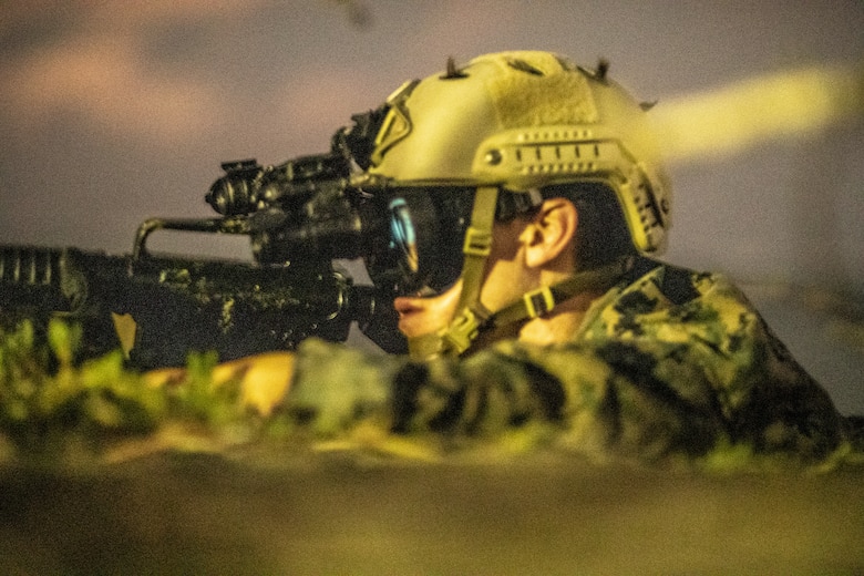 U.S. Marine Corps Cpl. Alexander Hermann, a native of San Antonio, Texas, a joint tactical air controller with 2nd Reconnaissance Battalion, 2nd Marine Division, participates in a night mission during Exercise Caribbean Coastal Warrior on Savaneta Kamp, Aruba, June 27, 2021. The exercise allows 2nd Recon to expand its knowledge and proficiency when operating in littoral and coastal regions while increasing global interoperability with 32nd Raiding Squadron, Netherlands Marine Corps.
