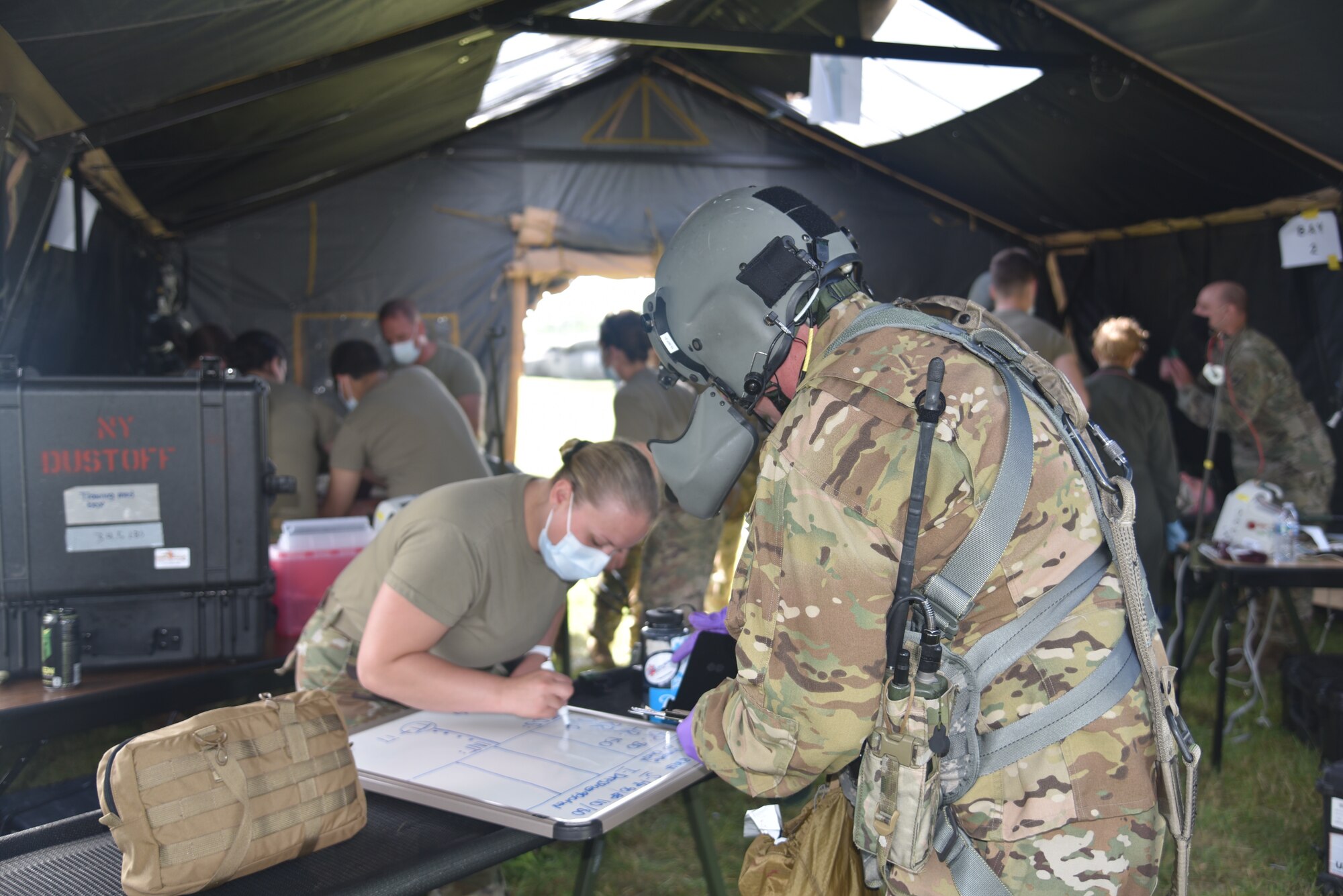 New York airmen and soldier conducted a joint medical training operation at Hancock Field Air National Guard base, Syracuse, N.Y. Soldiers from 171st General Aviation Support Battalion and the 174th Medical Group worked together to refresh their medical skills during a simulated environment. The training event included a medical evacuation in a UH-60 Black Hawk helicopter, handoff to medics on the ground to a medical tent.. (U.S. Air National Guard photo by Master Sgt. Barbara Olney)