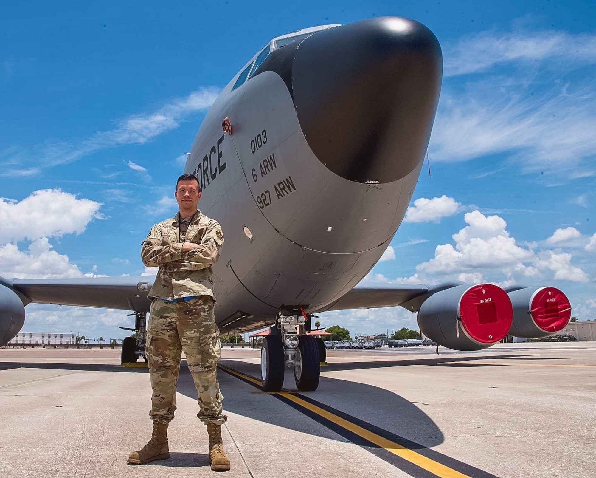 U.S. Air Force Tech. Sgt. Cody Plopper, a KC-135 Stratotanker aircraft crew chief with the 927th Air Refueling Wing, MacDill Air Force Base, Florida, stands in front of a KC-135 on the flight line July 10, 2021. Plopper was recently named as Air Force Reserve Command's Crew Chief of the Year. (U.S. Air Force photo by Staff Sgt. Tiffany A. Emery)