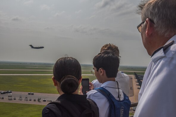 People look at aircraft taking off