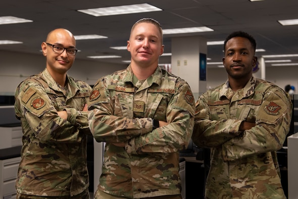 U.S. Air Force Airman 1st Class Pedro Andrada, left, Tech. Sgt. Joshua Boak, and Airman 1st Class Devin Moone, all assigned to the 36th Contracting Squadron, pose for a photo at Andersen Air Force Base, Guam, July 22, 2021. The 36th CONS team recently awarded two contracts worth a total of $64,000 to provide the Cook Islands with medical supplies needed for COVID-19 relief. The purchase consisted of medical supplies such as syringes, masks, gloves, blood administration sets, shoe covers and other necessary equipment.