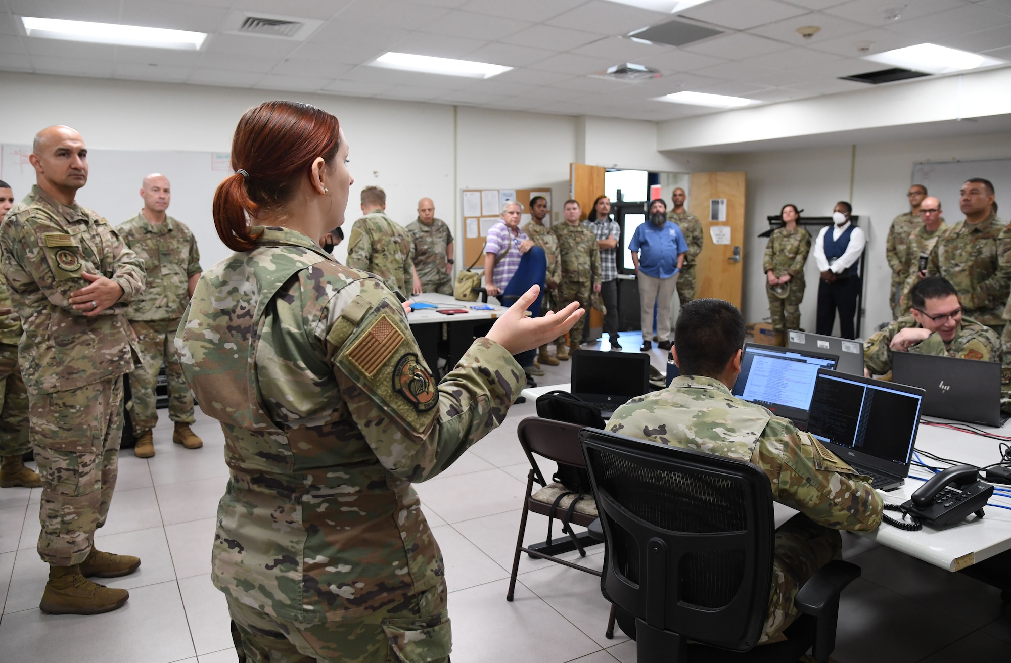 U.S. Air Force Tech. Sgt. Emily Sloan, 338th Training Squadron instructor, provides a cyber transport course briefing inside Bryan Hall at Keesler Air Force Base, Mississippi, July 21, 2021. The 81st Training Support Squadron hosted the Cyber Operations Specialty Training and Requirements Team Conference for cyber operations career field managers and MAJCOM functional managers July 19-23. (U.S. Air Force photo by Kemberly Groue)