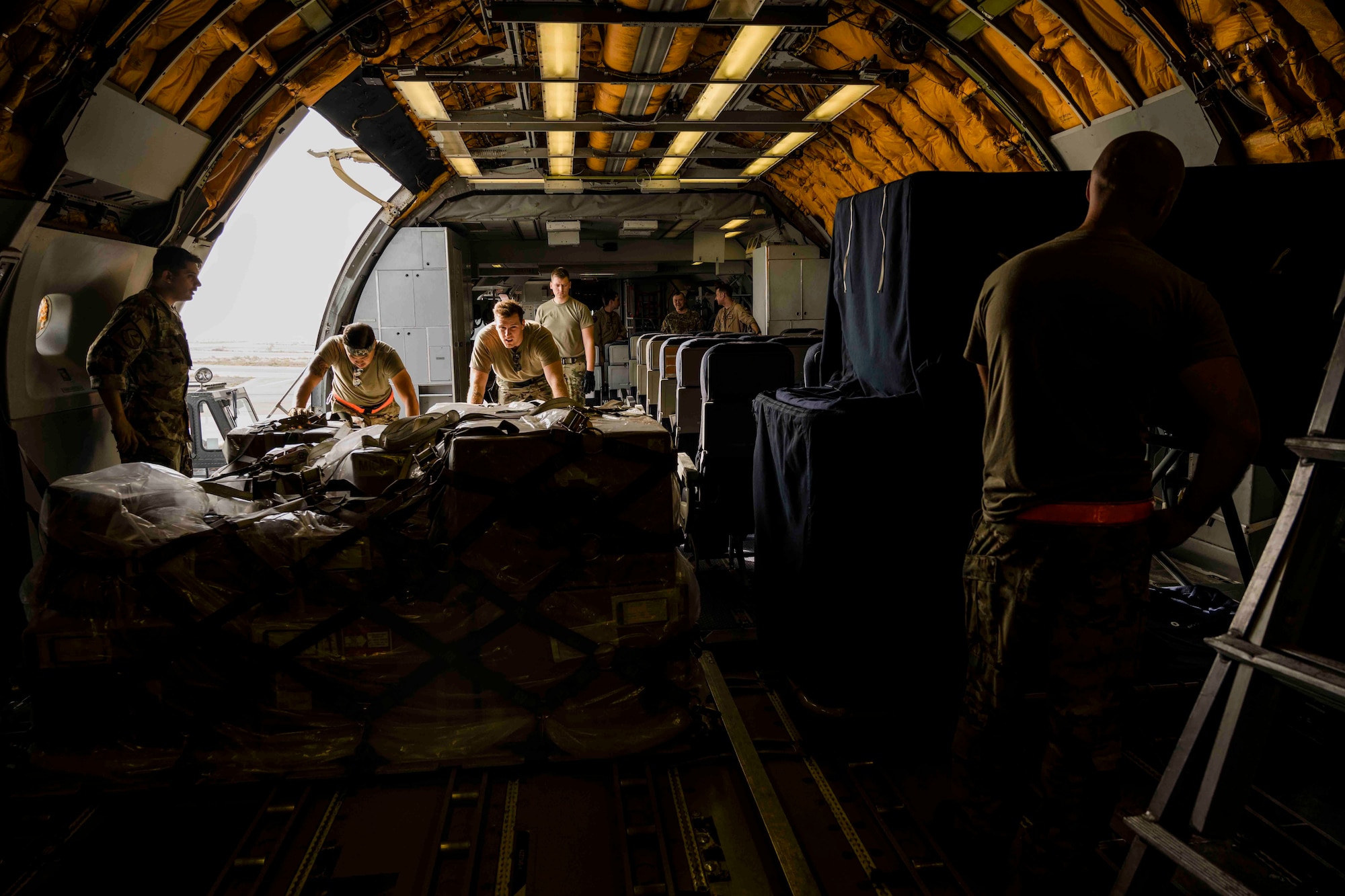 Airmen load cargo onto a KC-10 Extender aircraft