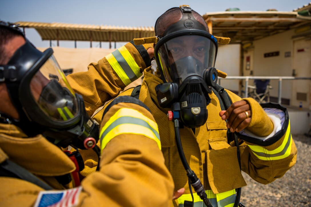 U.S. Air Force Airmen of the 380th Expeditionary Fire Department, conducts an exercise with base leadership at Al Dhafra Air Base, United Arab Emirates, July 24, 2021.