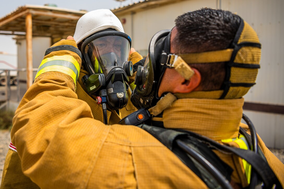 U.S. Air Force Airmen of the 380th Expeditionary Fire Department, conducts an exercise with base leadership at Al Dhafra Air Base, United Arab Emirates, July 24, 2021.
