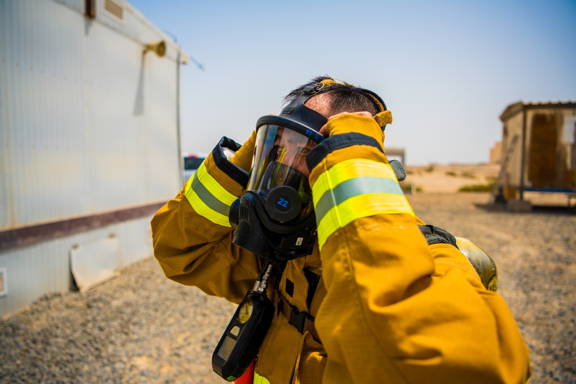 U.S. Air Force Airmen of the 380th Expeditionary Fire Department, conducts an exercise with base leadership at Al Dhafra Air Base, United Arab Emirates, July 24, 2021.