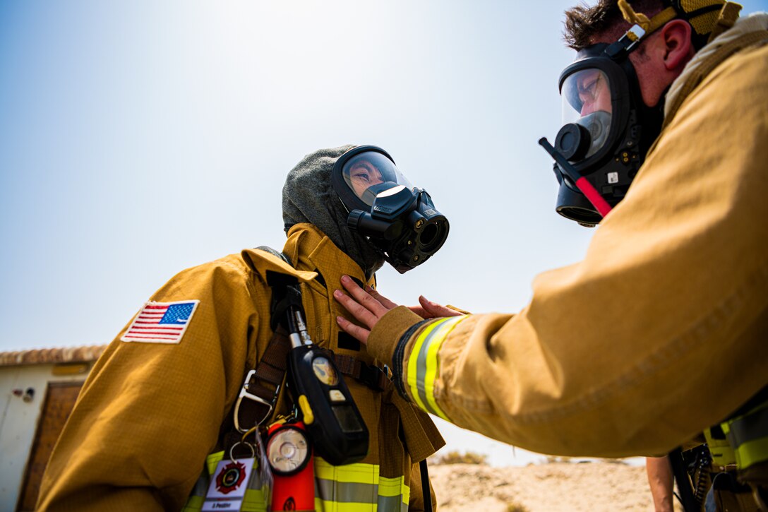 U.S. Air Force Airmen of the 380th Expeditionary Fire Department, conducts an exercise with base leadership at Al Dhafra Air Base, United Arab Emirates, July 24, 2021.