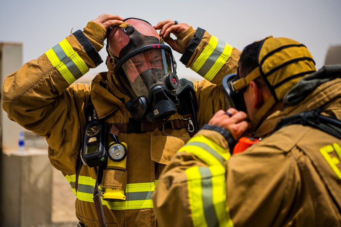 U.S. Air Force Airmen of the 380th Expeditionary Fire Department, conducts an exercise with base leadership at Al Dhafra Air Base, United Arab Emirates, July 24, 2021.