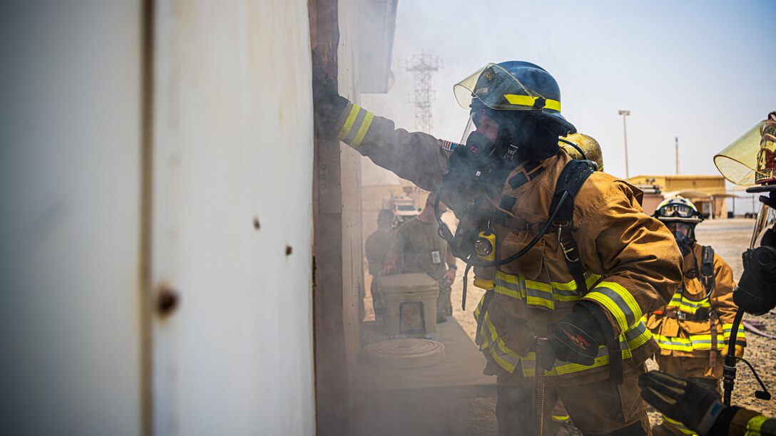 U.S. Air Force Airmen of the 380th Expeditionary Fire Department, conducts an exercise with base leadership at Al Dhafra Air Base, United Arab Emirates, July 24, 2021.
