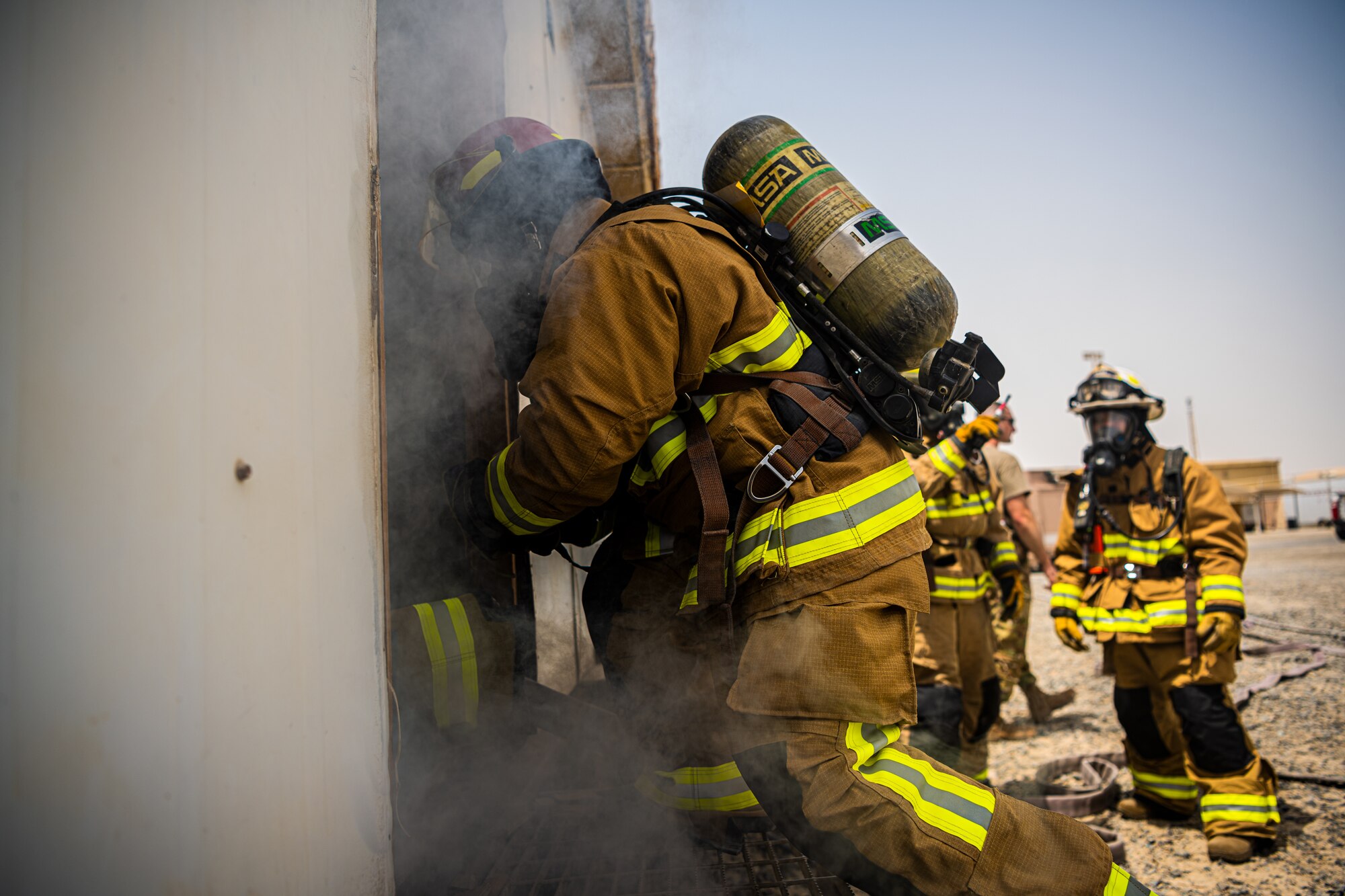 U.S. Air Force Airmen of the 380th Expeditionary Fire Department, conducts an exercise with base leadership at Al Dhafra Air Base, United Arab Emirates, July 24, 2021.