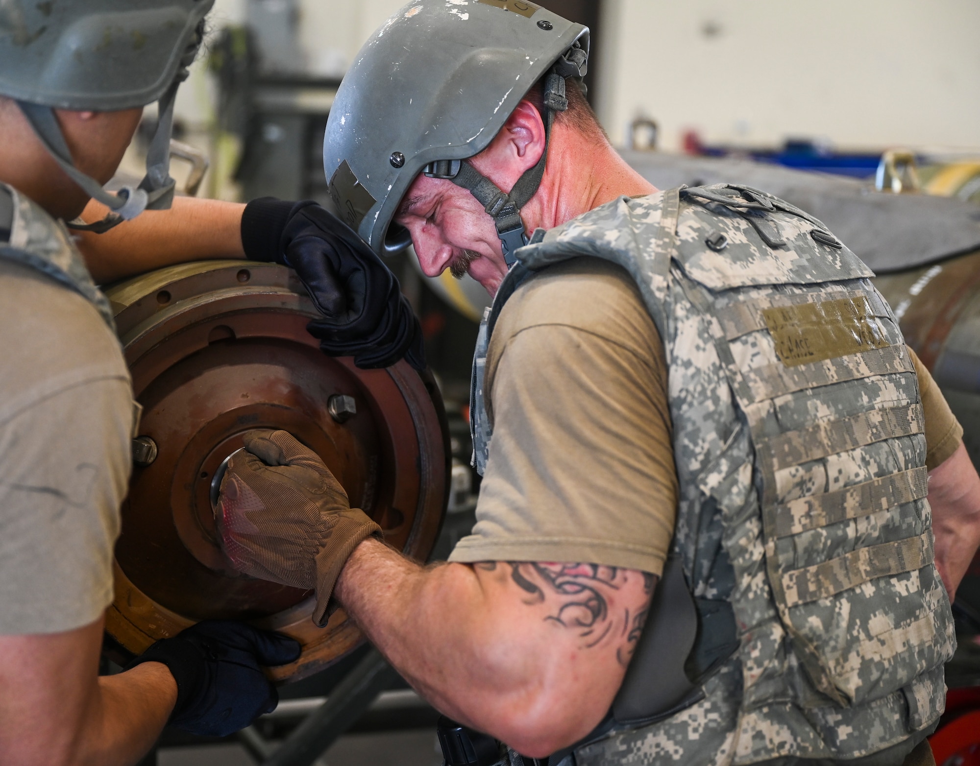 An Airman works on a bomb.