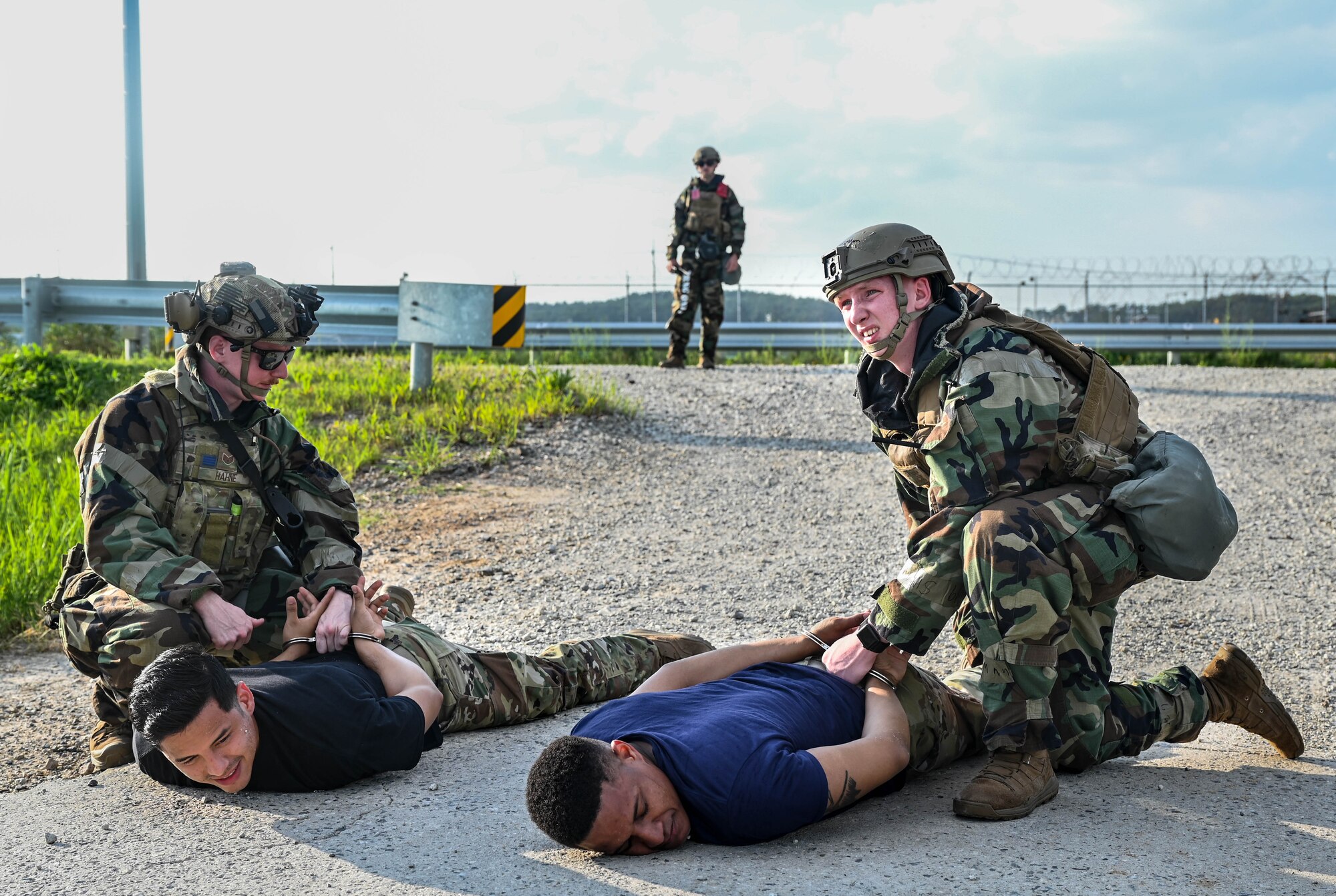 Airman arrest simulated perpetrators.