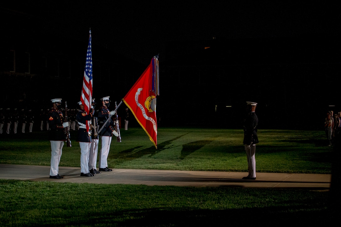 Marines with the Official U.S. Marine Corps Color Guard present the National Ensign during the Friday Evening Parade at Marine Barracks Washington, July 23, 2021.