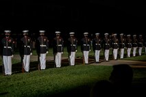 Marines with the Silent Drill Platoon execute their “long line” sequence during the Friday Evening Parade at Marine Barracks Washington, July 23, 2021.