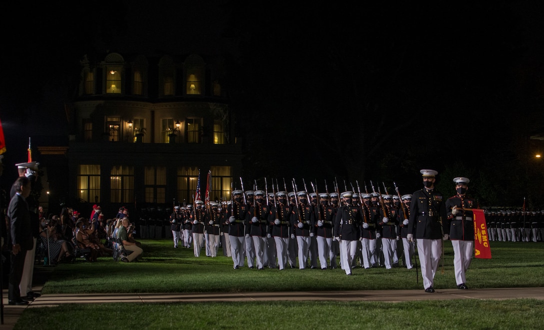 Marines with Alpha Company, Marine Barracks Washington conduct “pass in review” during the Friday Evening Parade at MBW, July 23, 2021. The hosting official was Lt. Gen. Mark R. Wise, Deputy Commander for Aviation, and the guest of honor was Ambassador Koji Tomita, Ambassador Extraordinary and Plenipotentiary of Japan to the United States. (U.S. Marine Corps photo by Lance Cpl. Mark Morales)