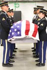 Six soldiers practice carrying a casket during the intensive Army National Guard Military Funeral Honors Level 2 course. Soldiers from seven different states participated in the 80-hour course held 11-24 July at Fort Indiantown Gap, Pa.