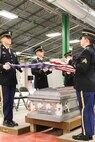 Soldiers participating in the Army National Guard Military Funeral Honors Level 2 course practice folding the flag as they prepare for their final test. Soldiers from seven different states participated in the 80-hour course held 11-24 July at Fort Indiantown Gap, Pa.