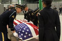 Trainers from the National Guard Bureau National Military Funeral Honors Program observe students demonstrating their proficiency of the six-Soldier flag fold during the MFH train-the-trainer course at Fort Indiantown Gap. Thirteen Soldiers from across the nation traveled to Pennsylvania to earn the NGB’s certification July 22 to become a MFH trainer. After successful completion of the course, the Soldiers will return to their states to train Soldiers in their home units to carry out MFH duties.