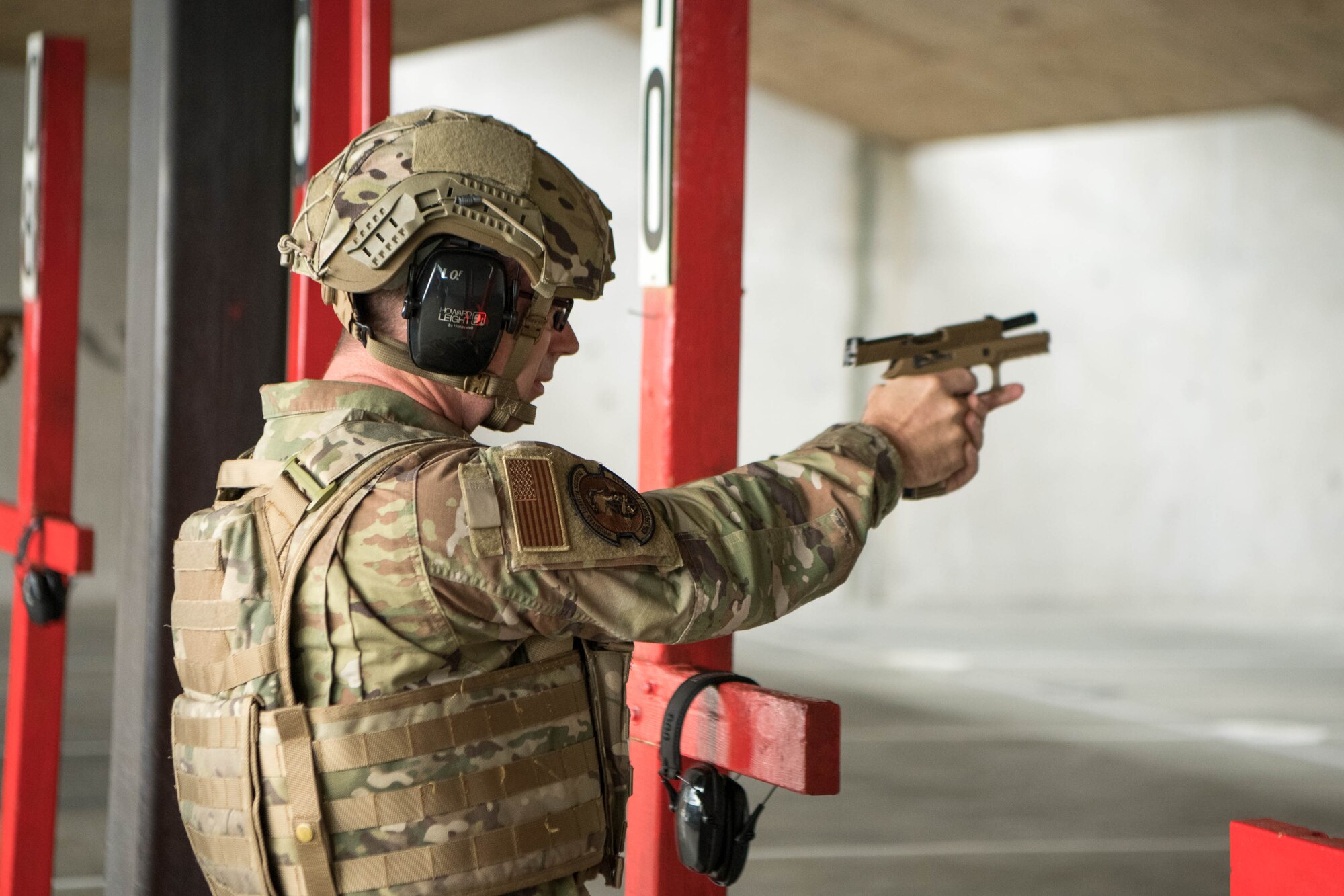 Chief Master Sgt. Timothy Bayes, 436th Airlift Wing command chief, fires an M18 pistol at the Combat Arms Training and Maintenance facility on Dover Air Force Base, Delaware, July 26, 2021.The M18 recently replaced the M9, following more than 30 years in operation. (U.S. Air Force photo by Mauricio Campino)