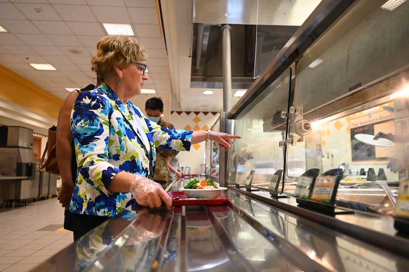 Virginia Penrod, Acting Undersecretary of Defense for Personnel and Readiness, orders food at the Resolute Café while on her immersion tour on Joint Base Langley-Eustis, Virginia, July 16, 2021. Penrod visited multiple agencies and spoke with Soldiers and civilians. Immersion tours help senior leaders to gain insight and context that could later influence the policy making process.