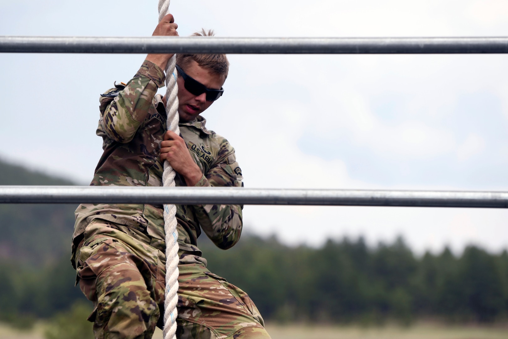 Army Sgt. William Lukens, a tactical power generator mechanic with the Tennessee Army National Guard’s 208th Area Support Medical Company, 301st Troop Command Battalion, 30th Troop Command Brigade, lifts his weight up a rope as part of an obstacle course during the 2021 Army National Guard Best Warrior Competition at Camp Navajo, Arizona, July 22, 2021. The competition spans three physically and mentally demanding days where competitors are tested on a variety of tactical and technical skills as they vie to be named the Army Guard’s Soldier and Noncommissioned Officer of the Year. The winners then represent the Army Guard in the Department of the Army Best Warrior Competition later this year.