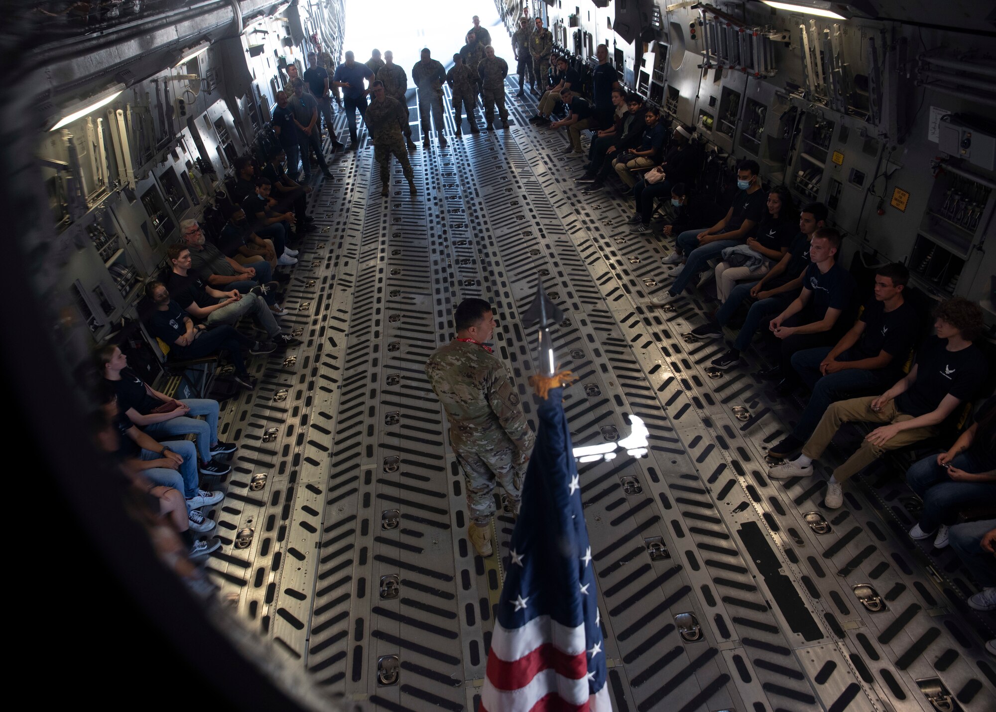 U.S. Air Force Chief Master Sgt. Joseph Arce, 62nd Airlift Wing command chief, addresses Air Force recruits in the 361st Recruiting Squadron Delayed Entry Program during their visit at Joint Base Lewis-McChord, Washington, July 23, 2021. The future Airmen and their recruiters visited JBLM to tour different squadrons, a C-17 Globemaster III static display and take the oath of enlistment. (U.S. Air Force photo by Senior Airman Zoe Thacker)