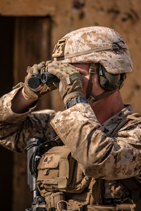 A Marine with Lima Company, 3rd Battalion, 25th Marines, 4th Marine Division, scans for targets on Range 400 during Integrated Training Exercise (ITX) 4-21 at Marine Corps Air Ground Combat Center, Twentynine Palms, California on July 25, 2021. Range 400 is a company-sized live-fire assault range that requires complex coordination of fires, producing combat-ready Reserve Marines prepared to augment and reinforce the Active Component. (U.S. Marine Corps photo by Sgt. JVonnta Taylor)