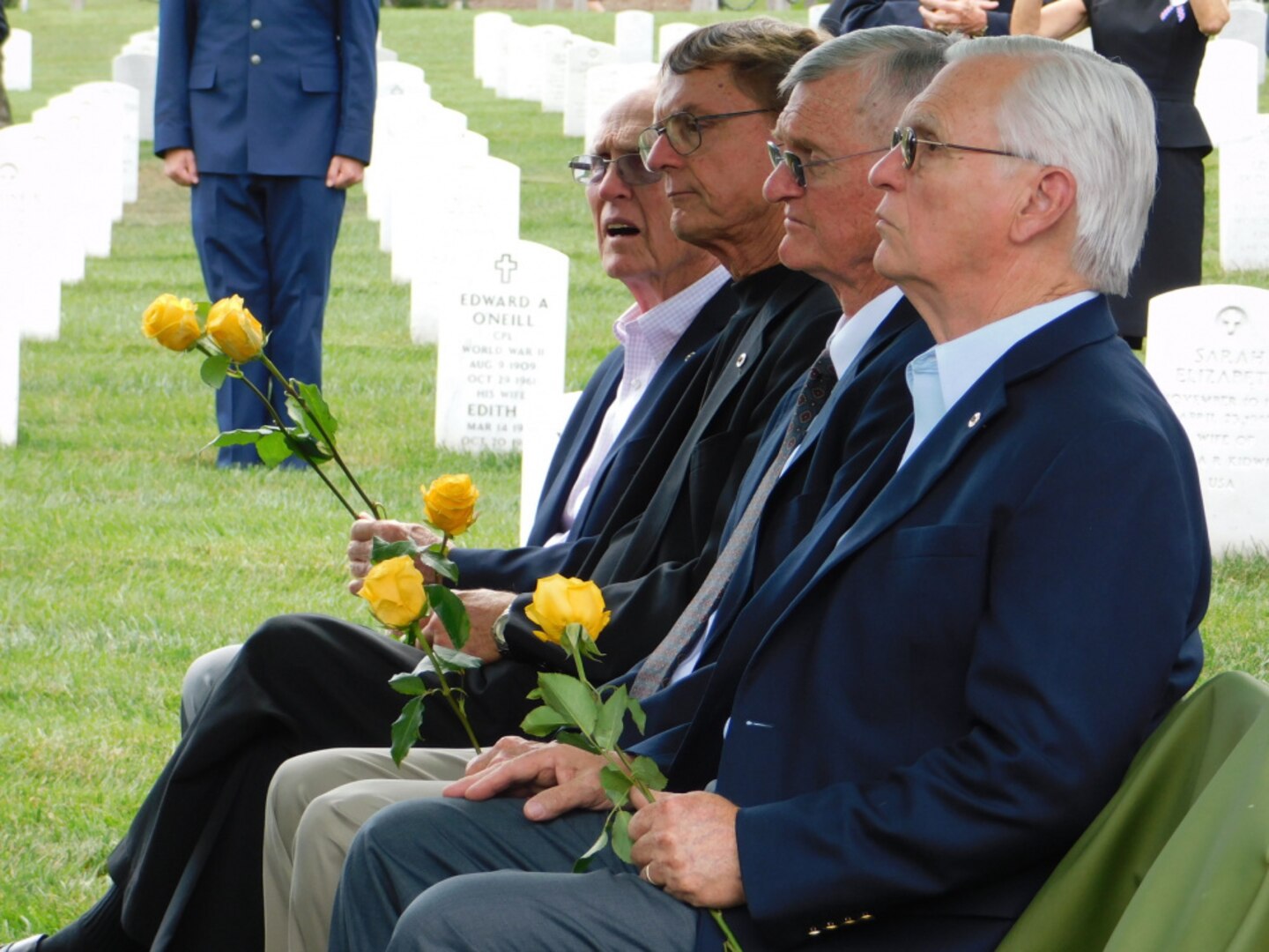 The four sons of Major Harvey Storms listen to a graveside service for their father who was buried in Arlington National Cemetery on July 16, 2021. Major Storms was reported missing in action on Dec. 1, 1950, when his unit was attacked by enemy forces near the Chosin Reservoir, North Korea. Following the battle, his remains could not be recovered. The Defense POW/MIA Accounting Agency was able to identify the remains in 2019. (Defense Photo by Ashley M. Wright)