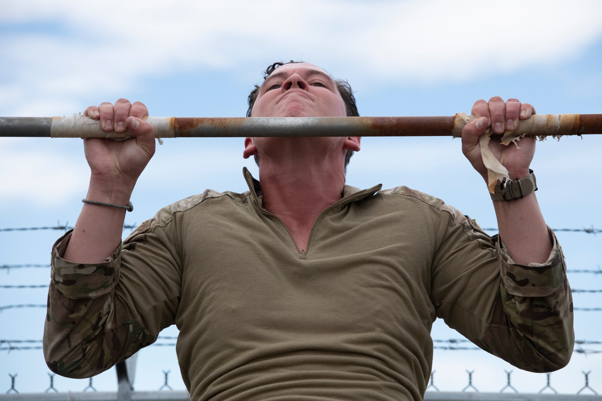 U.S. Air Force Staff Sgt. David Harris, tactical air control party (TACP) specialist, 3rd Air Support Operations Squadron, performs pull-ups during the Chaos Challenge 2021 at Joint Base Elmendorf-Richardson, Alaska, July 13, 2021. The Chaos Challenge 2021 was a multi-day series of mental and physical contests sponsored by the 1st Air Support Operations Group with participants from the 3rd, 5th, 25th, and 604th Air Support Operations Squadrons and a guest team from the 673d Security Forces Squadron. The winner of the competition will go on to compete in Lightning Challenge 2021 to determine the best two-man TACP team in the Air Force.