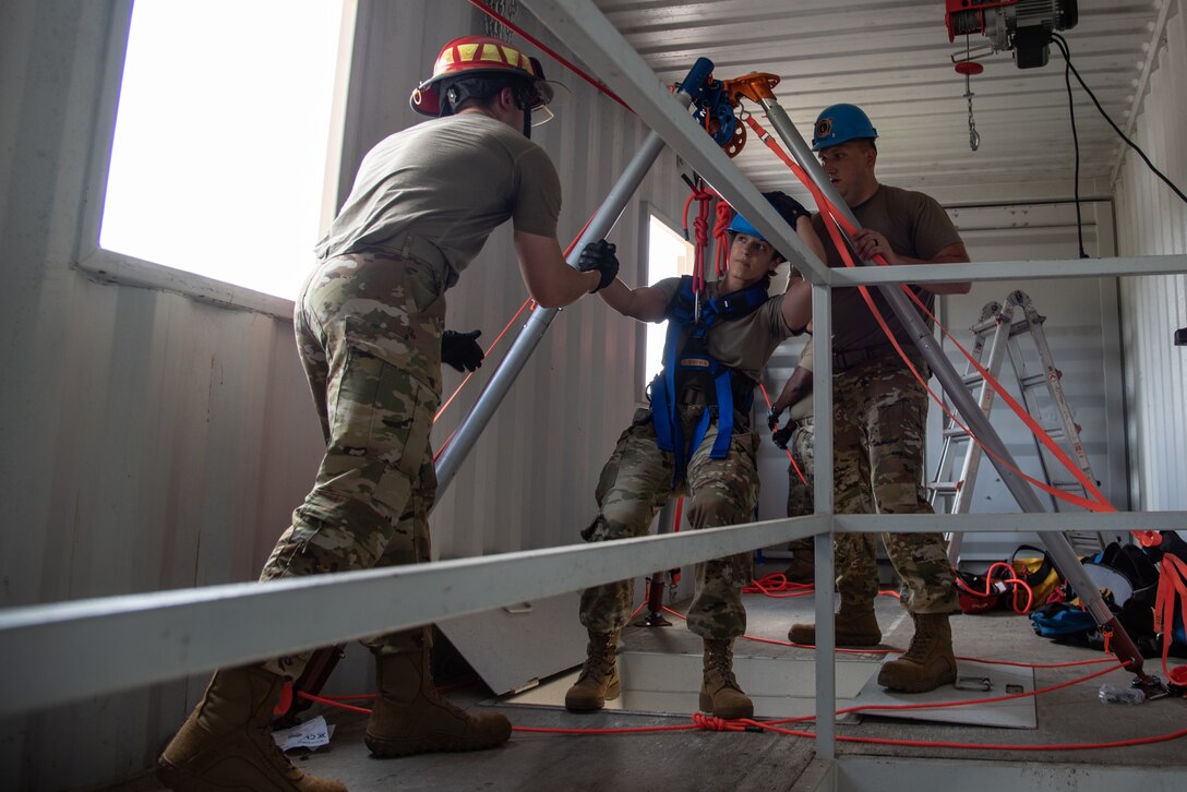 Citizen Airman, assigned to the 932nd Airlift Wing, Mission Support Group, Civil Engineering Squadron, participate in confined space training, at Scott Air Force Base, Illinois, July 11, 2021. This training is conducted to highlight and reduce the risks associated with confined space operations. (U.S. Air Force Photo by Staff Sgt. Brooke Spenner)