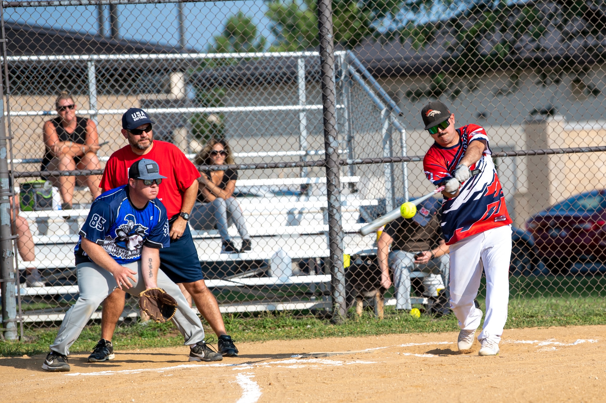 Staff Sgt. Kyle Lewsader, 436th Maintenance Squadron Isochronal Maintenance Dock aircraft inspection craftsman, hits a softball during an intramural game against the 436th Security Forces Squadron on Dover Air Force Base, Delaware, July 26, 2021. The 436th SFS won the game 13-4. (U.S. Air Force photo by Tech. Sgt. Nicole Leidholm)