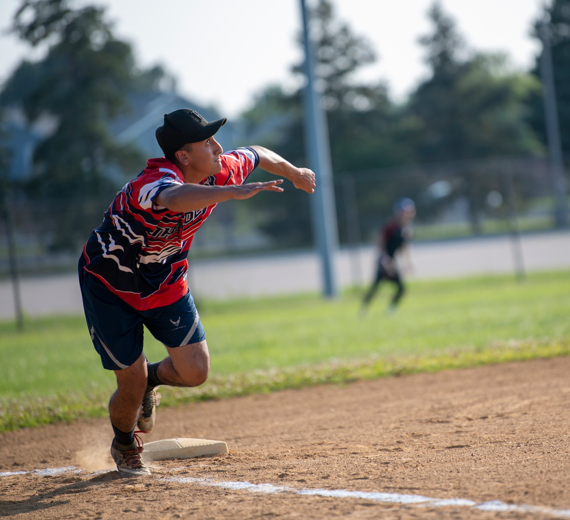 Airman 1st Class Ryan Serrano, 436th Maintenance Squadron Isochronal Maintenance Dock aircraft inspection team member, watches a ball as he runs home during an intramural softball game against the 436th Security Forces Squadron on Dover Air Force Base, Delaware, July 26, 2021. The 436th SFS won the game13-4. (U.S. Air Force photo by Tech. Sgt. Nicole Leidholm)