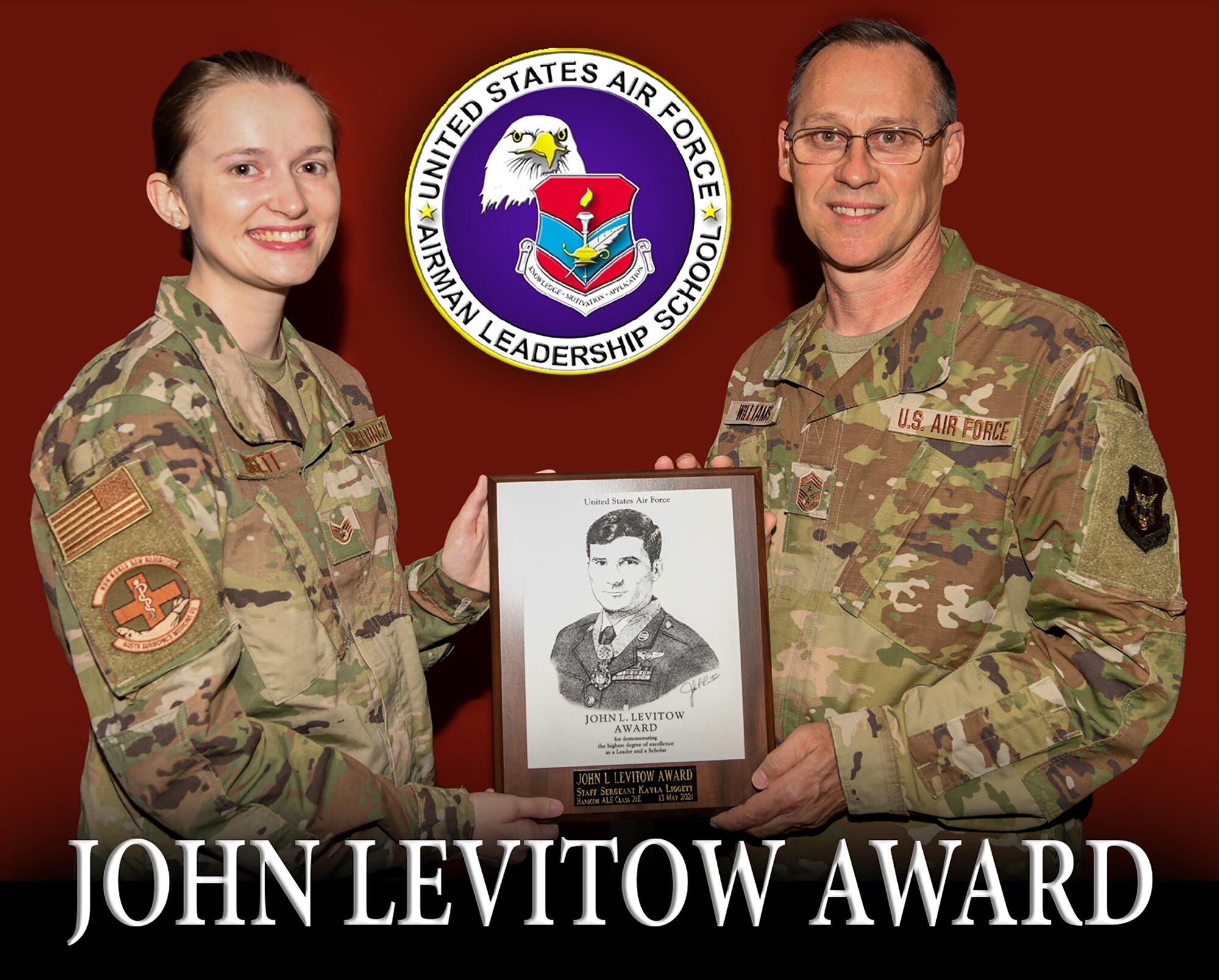 Chief Master Sgt. Christopher Williams, 445th Airlift Wing command chief, presents the John L. Levitow Award to Staff Sgt. Kayla Liggett, 445th Aerospace Medicine Squadron health services management technician, July 11, 2021 for her performance during a virtual Airman Leadership School conducted at Hanscom Air Force Base, Maine.