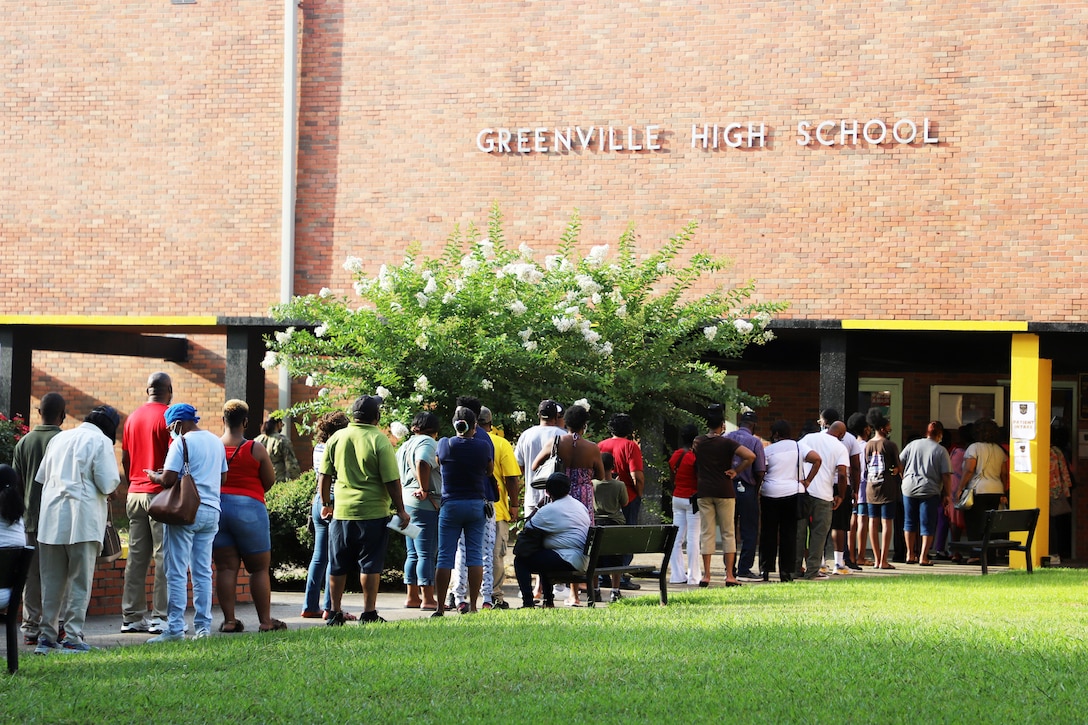 Community members line up outside of Greenville High School for the no-cost medical, dental and optometry services being provided at Delta Wellness 2021. (U.S. Air Force photo by 1st Lt. Briell Zweygardt)