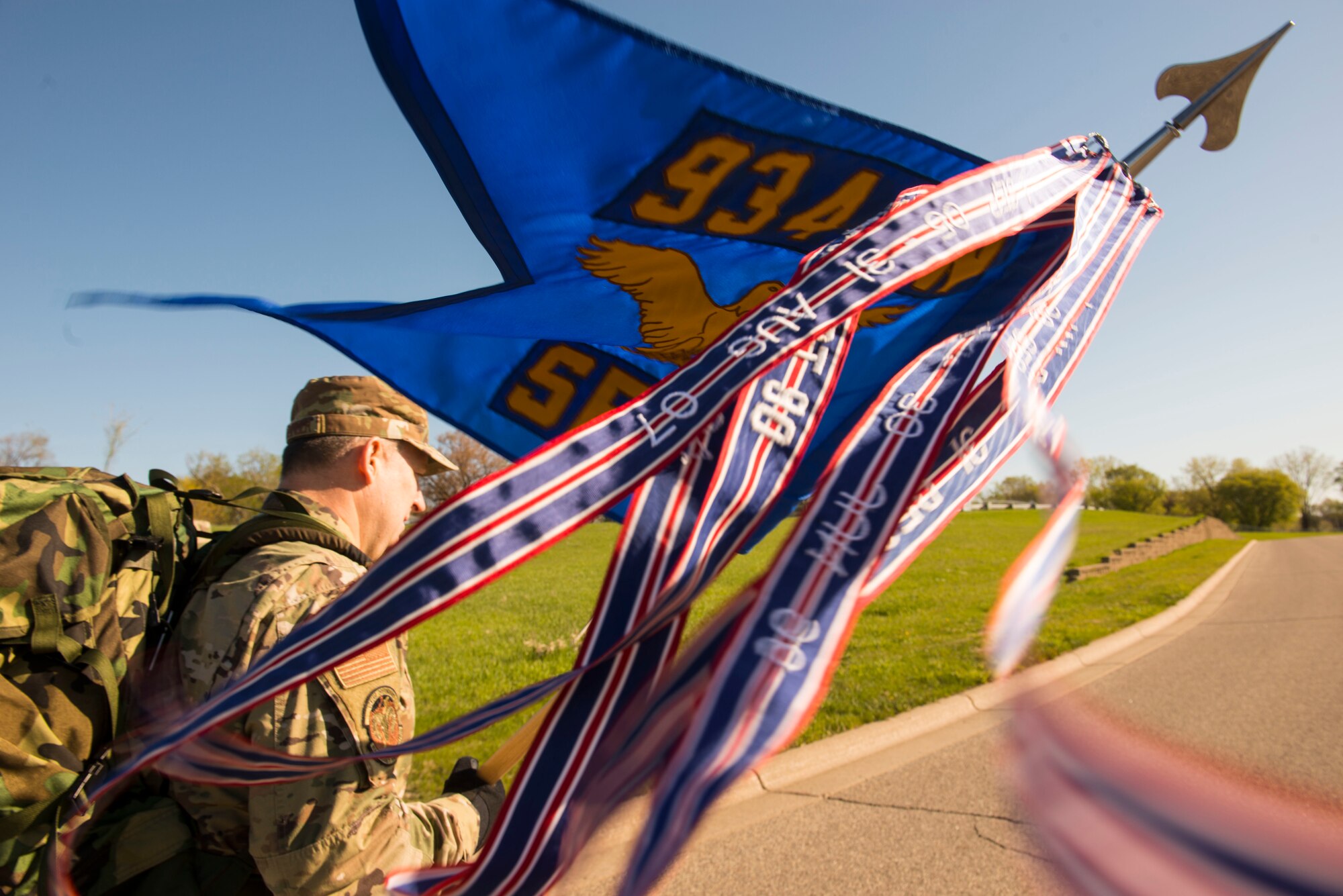 Master Sgt. Glen Kramlinger, 934th Security Forces Squadron plans and programs manger, holds the 934 SFS guidon during a 4.5 mile ruck march in support of the Resolute Defender Ruck Challenge at Minneapolis-St. Paul Air Reserve Station, April 30, 2021. The intent for this 12 month challenge is to build and solidify resiliency, camaraderie, and communication. Currently, 40 Airmen and civilians, comprising 19 different teams, are taking part in the challenge. (Air Force photo by Chris Farley)