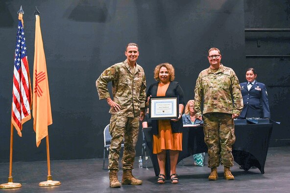 An award is being presented at a ceremony.