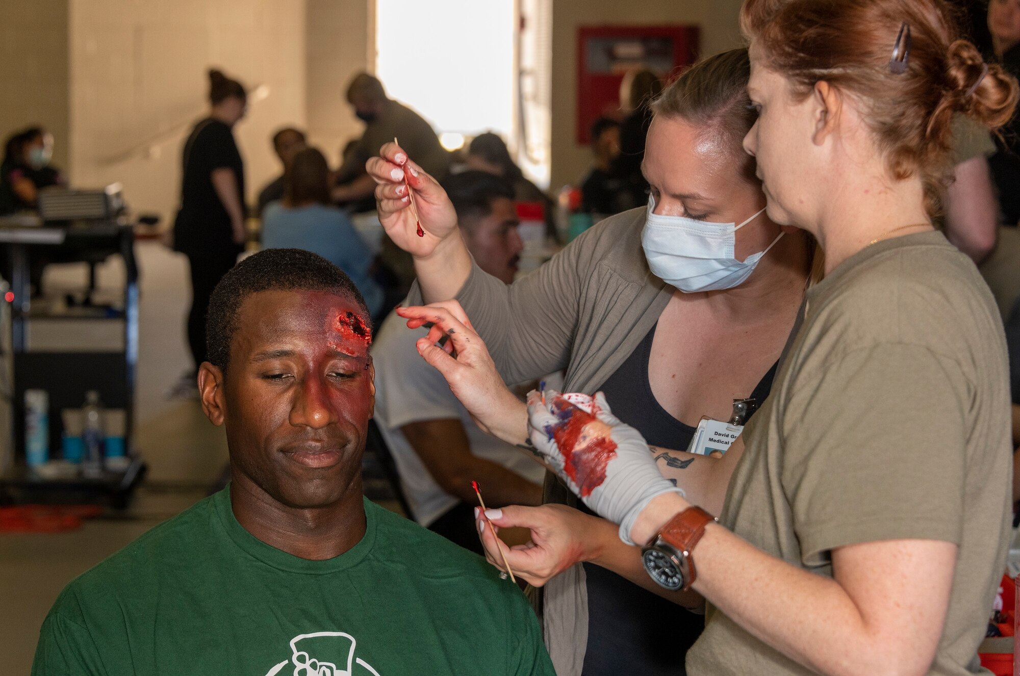 Airmen participating in a medical training exercise