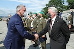 Czech Republic Minister of Defence, Lubomir Metna, greeting Dr. Stephen D. O’Regan (right), as he awarded him the Cross of Merit medal during an Armed Forces Day ceremony in Prague, Czech Republic, June 30, 2021.