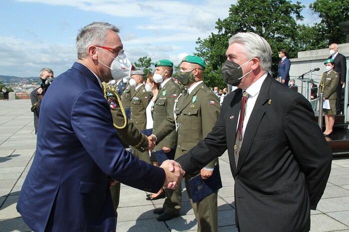 Czech Republic Minister of Defence, Lubomir Metna, greeting Dr. Stephen D. O’Regan.