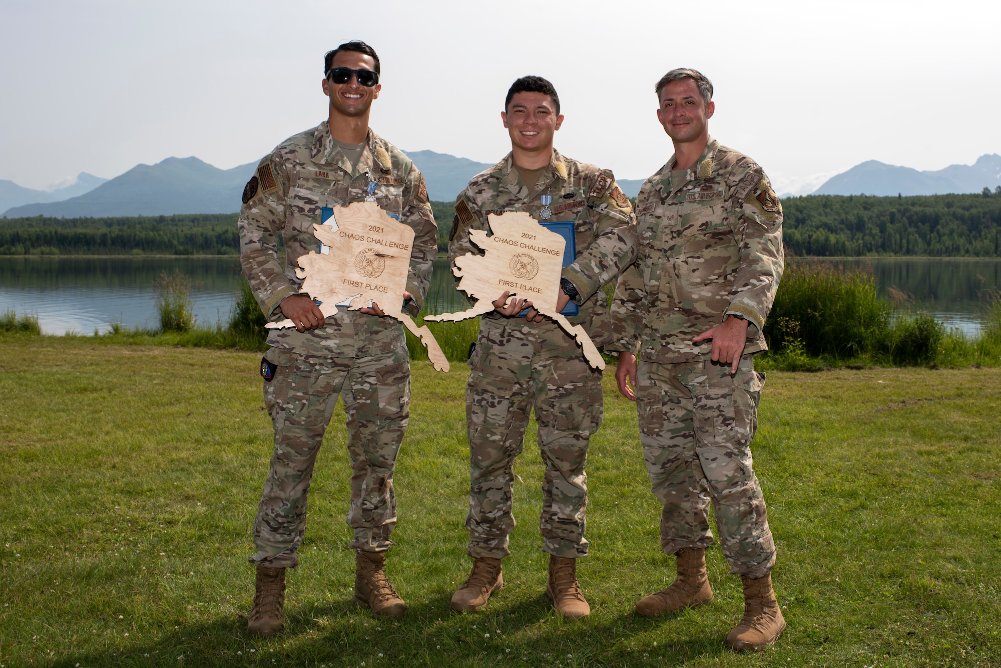 U.S. Air Force Staff Sgt. Jacob Lara, left, Senior Airman Matthew Arellano, and Staff Sgt. Thomas Rodriguez, 25th Air Support Operations Squadron pause for a photo after winning the Chaos Challenge 2021 at Joint Base Elmendorf-Richardson, Alaska, July 16, 2021. The Chaos Challenge 2021 was a multi-day series of mental and physical contests sponsored by the 1st Air Support Operations Group with participants from the 3rd, 5th, 25th, and 604th Air Support Operations Squadrons and a guest team from the 673d Security Forces Squadron. The winner of the competition will go on to compete in Lightning Challenge 2021 to determine the best two-man TACP team in the Air Force.