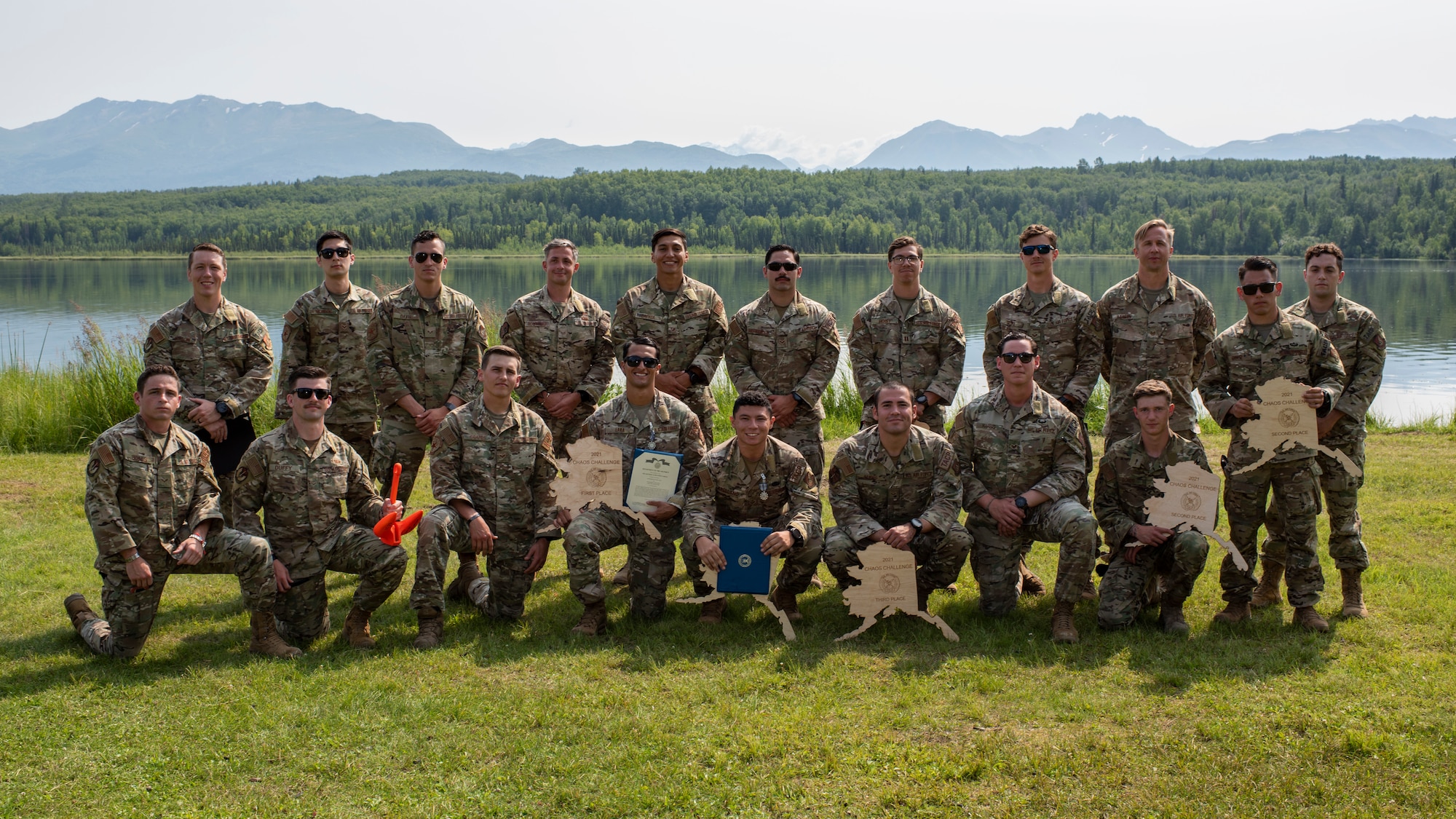 U.S. Air Force tactical air control party (TACP) specialists from the 1st Air Support Operations Group and members of the 673d Security Forces Squadron pause for a group photo after completing the Chaos Challenge 2021 at Joint Base Elmendorf-Richardson, Alaska, July 16, 2021. The Chaos Challenge 2021 was a multi-day series of mental and physical contests sponsored by the 1st Air Support Operations Group with participants from the 3rd, 5th, 25th, and 604th Air Support Operations Squadrons and a guest team from the 673d Security Forces Squadron. The winner of the competition will go on to compete in Lightning Challenge 2021 to determine the best two-man TACP team in the Air Force.