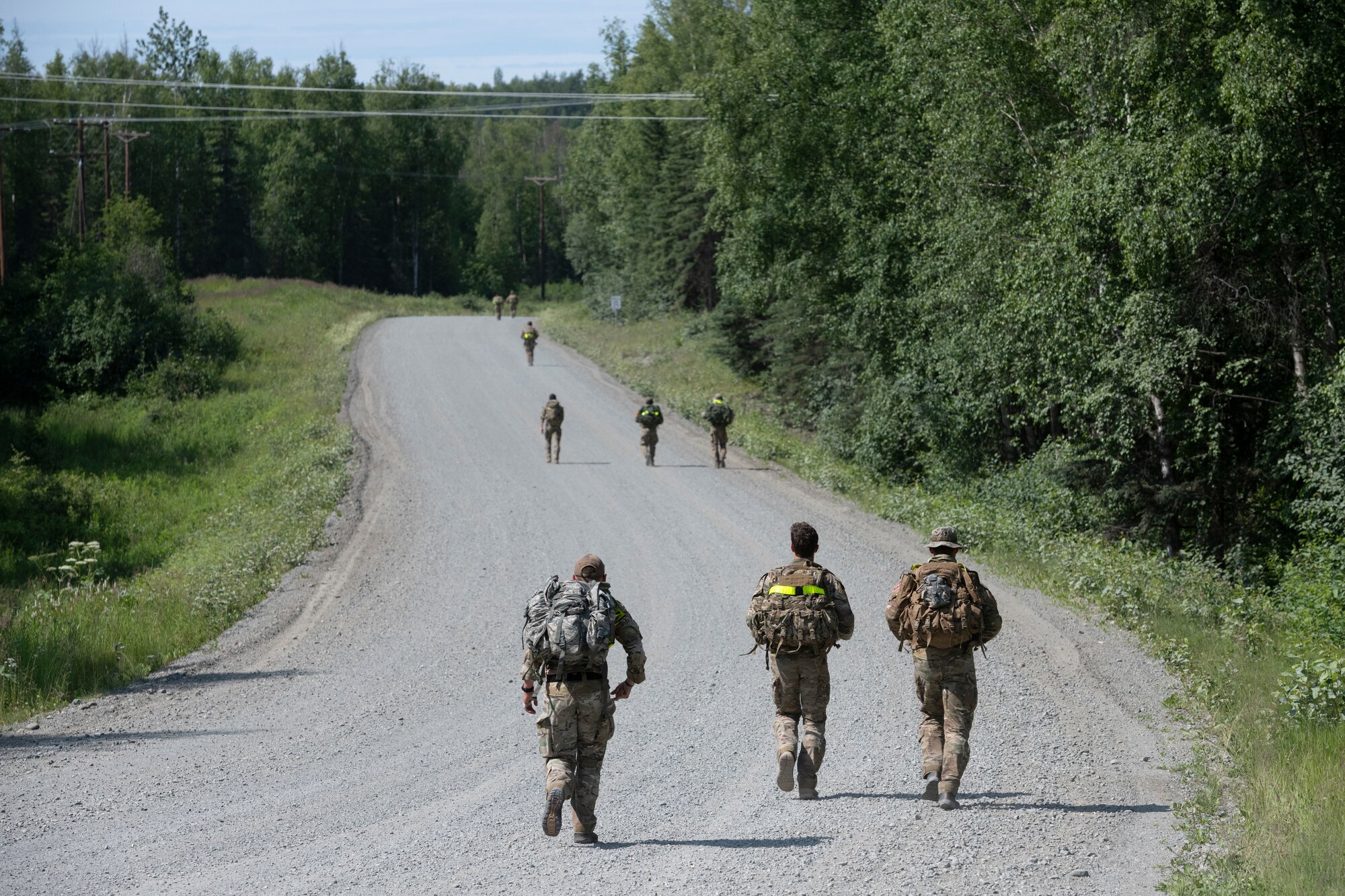 U.S. Air Force tactical air control party (TACP) specialists from the 1st Air Support Operations Group compete in a ruck run during the Chaos Challenge 2021 at Joint Base Elmendorf-Richardson, Alaska, July 14, 2021. The Chaos Challenge 2021 was a multi-day series of mental and physical contests sponsored by the 1st Air Support Operations Group with participants from the 3rd, 5th, 25th, and 604th Air Support Operations Squadrons and a guest team from the 673d Security Forces Squadron. The winner of the competition will go on to compete in Lightning Challenge 2021 to determine the best two-man TACP team in the Air Force.