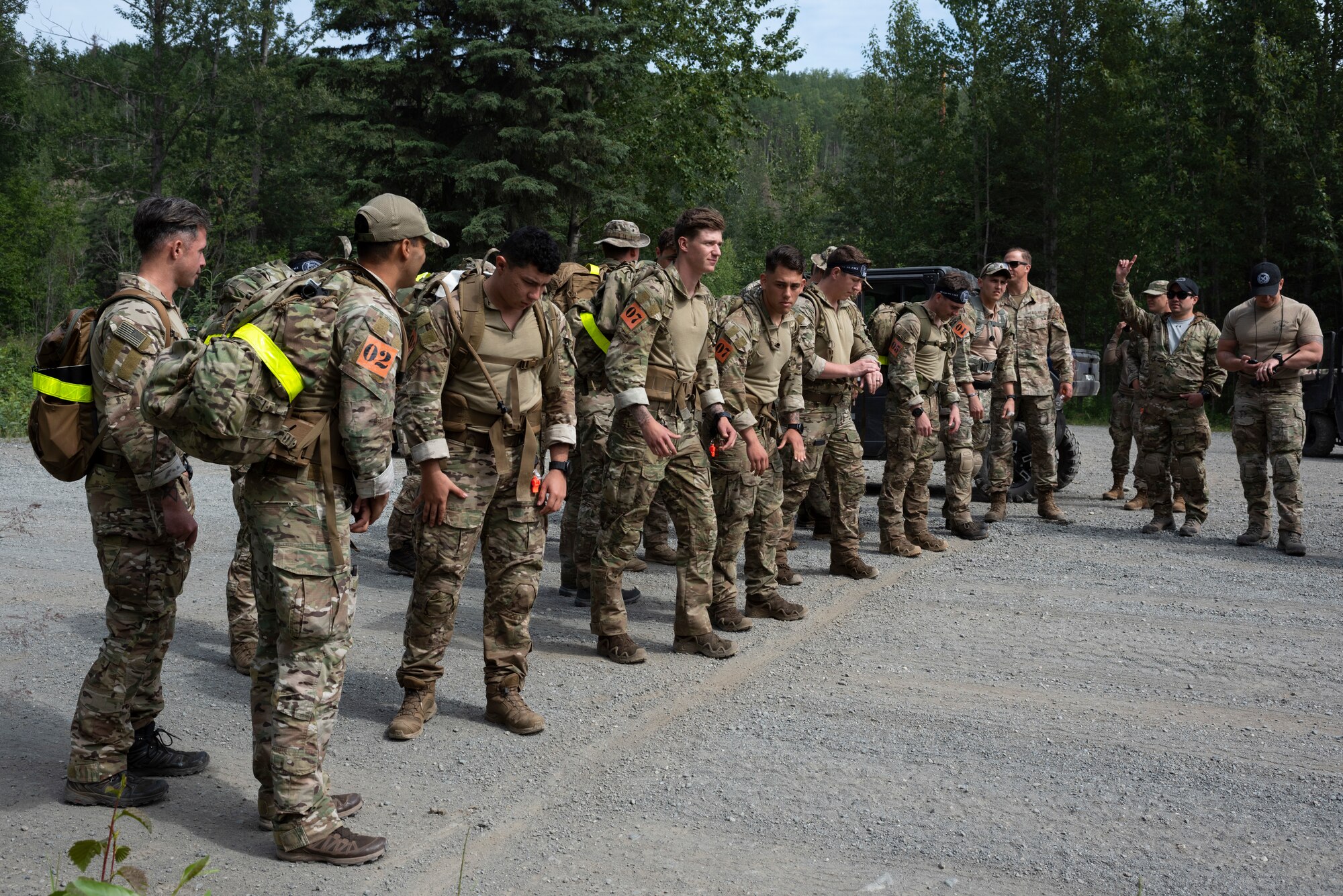 U.S. Air Force tactical air control party (TACP) specialists from the 1st Air Support Operations Group wait to begin a timed ruck run during the Chaos Challenge 2021 at Joint Base Elmendorf-Richardson, Alaska, July 14, 2021. The Chaos Challenge 2021 was a multi-day series of mental and physical contests sponsored by the 1st Air Support Operations Group with participants from the 3rd, 5th, 25th, and 604th Air Support Operations Squadrons and a guest team from the 673d Security Forces Squadron. The winner of the competition will go on to compete in Lightning Challenge 2021 to determine the best two-man TACP team in the Air Force.