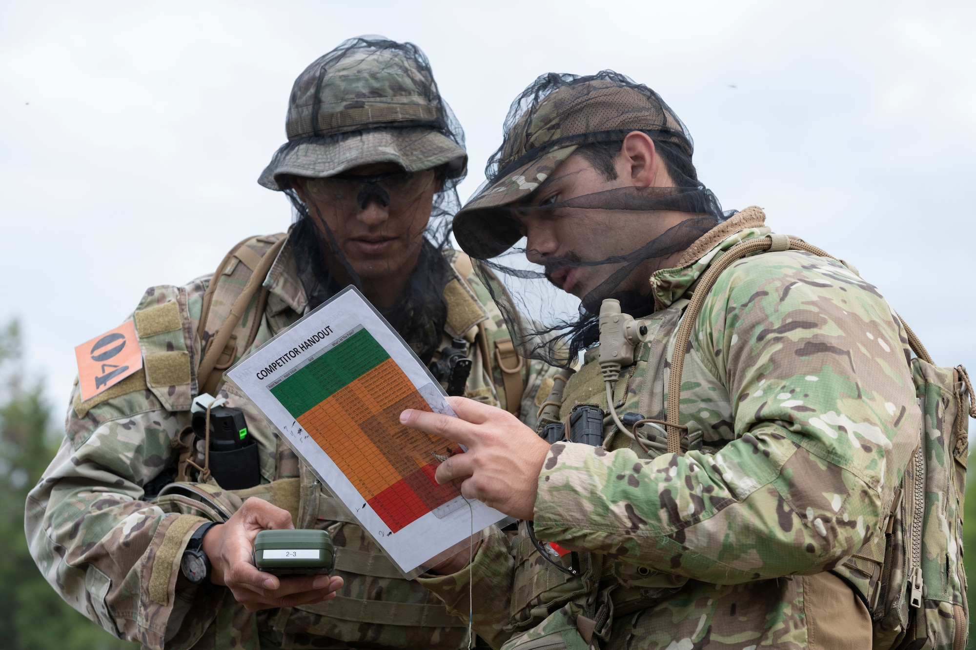 U.S. Air Force Staff Sgt. Leodan Zapata, left, and Senior Airman Mario Hernandez, tactical air control party (TACP) specialists, 5th Air Support Operations Squadron, prepare for a land navigation event during the Chaos Challenge 2021 at Joint Base Elmendorf-Richardson, Alaska, July 14, 2021. The Chaos Challenge 2021 was a multi-day series of mental and physical contests sponsored by the 1st Air Support Operations Group with participants from the 3rd, 5th, 25th, and 604th Air Support Operations Squadrons and a guest team from the 673d Security Forces Squadron. The winner of the competition will go on to compete in Lightning Challenge 2021 to determine the best two-man TACP team in the Air Force.
