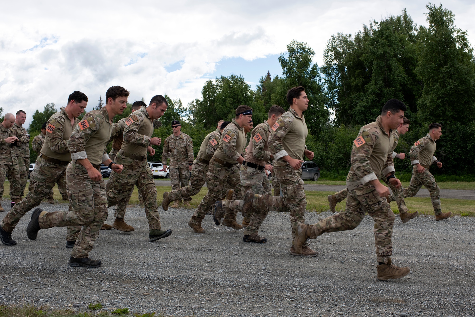U.S. Air Force tactical air control party specialists from the 1st Air Support Operations Group begin the timed run portion of a physical training event during the Chaos Challenge 2021 at Joint Base Elmendorf-Richardson, Alaska, July 13, 2021. The Chaos Challenge 2021 was a multi-day series of mental and physical contests sponsored by the 1st Air Support Operations Group with participants from the 3rd, 5th, 25th, and 604th Air Support Operations Squadrons and a guest team from the 673d Security Forces Squadron. The winner of the competition will go on to compete in Lightning Challenge 2021 to determine the best two-man TACP team in the Air Force.