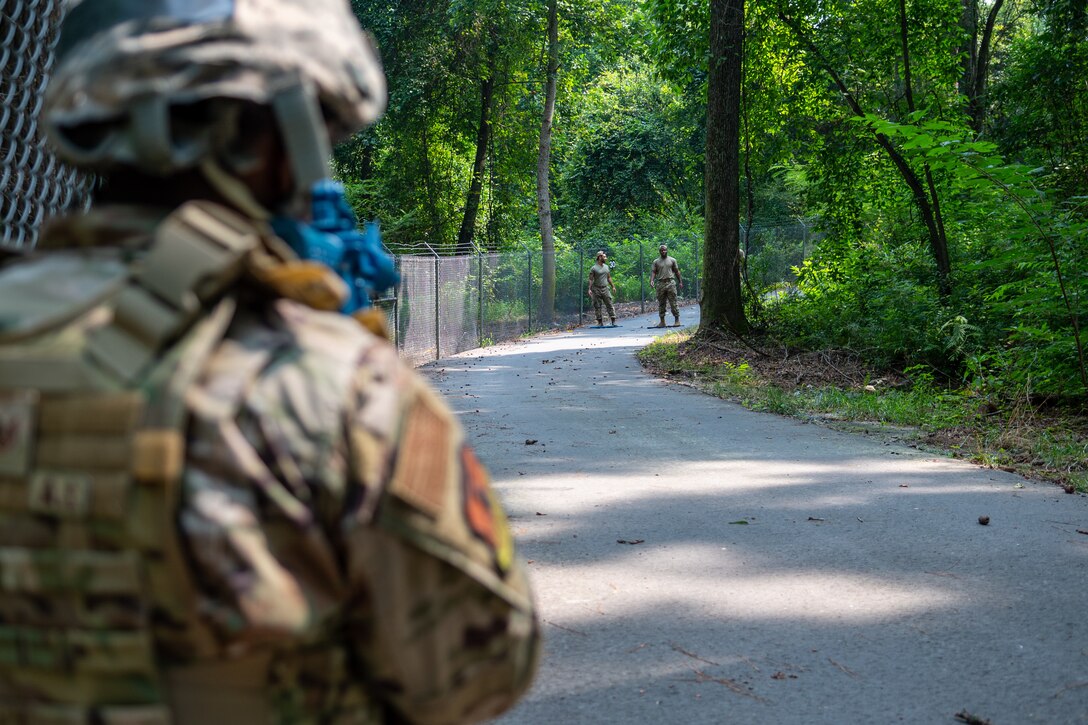 Airmen from the 4th Civil Engineer Squadron practice squad movements as part of the Prime Base Engineer Emergency Force, or Prime BEEF, program at Seymour Johnson Air Force Base, North Carolina, July 22, 2021. Airmen simulated combat engagements to prepare for similar situations they might encounter while in a deployed environment. (U.S. Air Force photo by Airman 1st Class David Lynn)