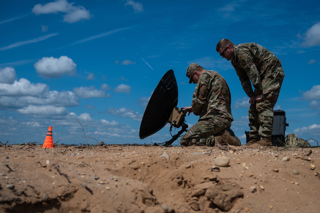 Airmen set up satellite communications.